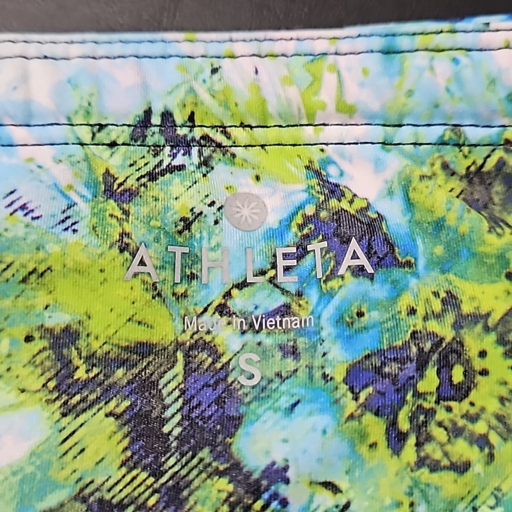 Athleta Athletic Shorts featuring vibrant colors w signature zipper on back.